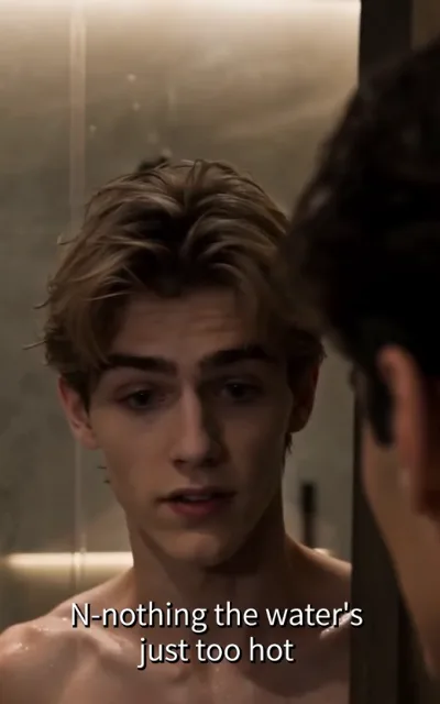 The flustered mirror — first-person at a steamed mirror, the reflection of a golden-brown-curled young man freshly showered, eyes rimmed red, gaze dodging sideways, lips parted mid-stammer, another man's head and ear at frame edge, the caption N-nothing the water's just too hot beneath (ep6; subtitles as aired; intimacy-adjacent frame as aired, not amplified)