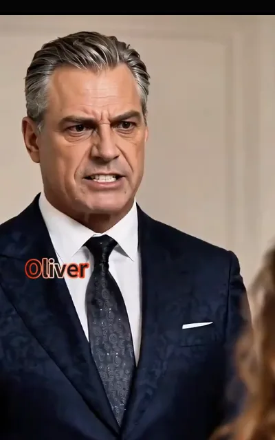 The family-side confrontation — a silver-grey comb-back man in a navy suit mid-reprimand, jaw set, the station on-card caption reading only “Oliver” at the corner (ep1; station character card as aired — 639832 precedent, design element captured, not deep-anchored)
