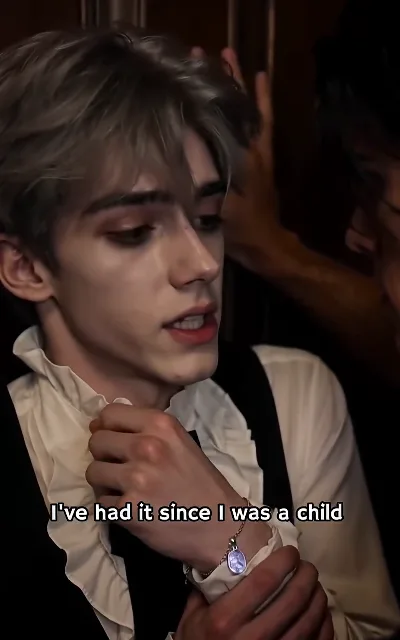 "I’ve had it since I was a child" — the bracelet close-up: the token’s provenance, stated while the violet gem glows (ep2, subtitles as aired)