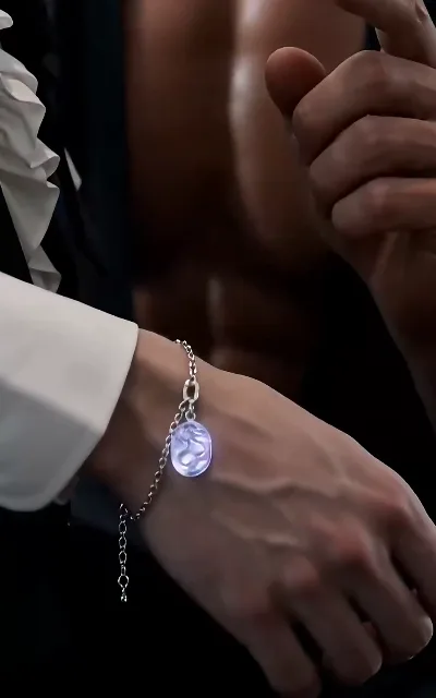 The violet-gem bracelet, close-up — the token’s second on-screen echo (ep3)