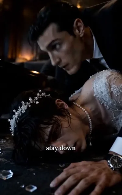 Frame ep04-f02 from episode 4 — He pulls Eli out of danger (ep4; subtitles as aired — Stay down. I saved you. You ruined my carpet. You're welcome.)