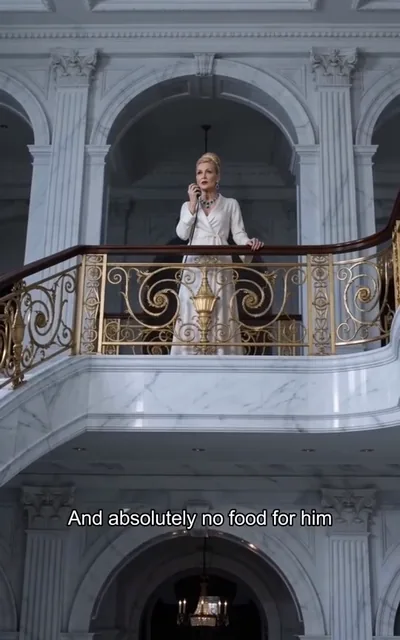 Frame ep03-f00 from episode 3 — The matriarch's order from the balcony (ep3; subtitles as aired — Cut the heat to that miserable storage room and absolutely no food for him.)