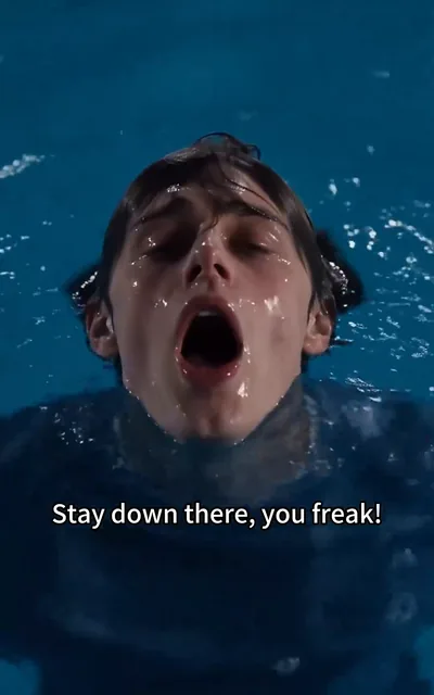 Frame ep01-f00 from episode 1 — The bully shoves the boy toward the deep end (ep1; subtitles as aired — Stay down there, you freak. Let's see you swim now, loser.)