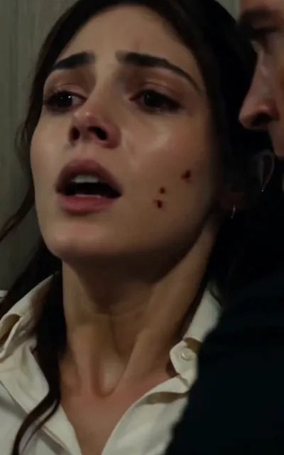 Frame ep03-f03 from episode 3 — Kai shields her under gunfire (ep3; subtitles as aired — Stay down. Are you hit? No. Then move.)