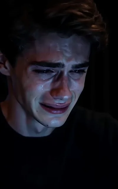 Frame ep03-f00 from episode 3 — Ethan crying in the dark (ep3; subtitles as aired — I miss you, Leo.)