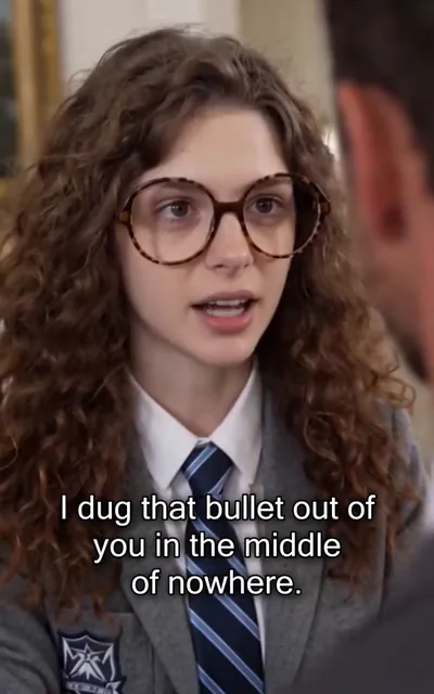 Frame ep03-f02 from episode 3 — Nina close-up, speaking (ep3; subtitles as aired — I dug that bullet out of you in the middle of nowhere.)