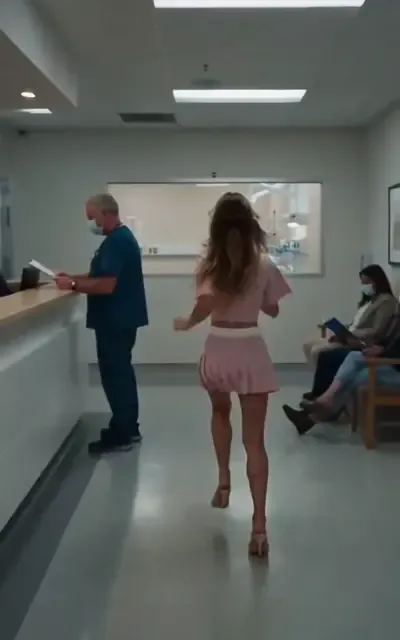 Frame ep01-f04 from episode 1 — Eileen races through the hospital corridor (ep1; subtitles as aired — Are you hurt? Tell me where you are.)