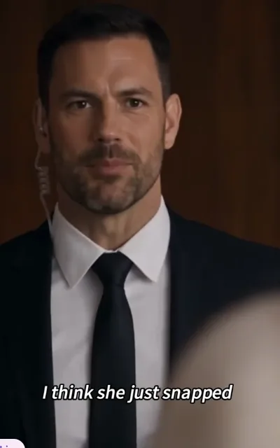 Bodyguard in black suit with earpiece, subtitle: I think she just snapped