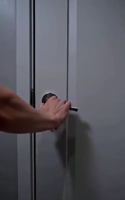 The hand on the door handle — a quiet beat as the free episodes close (ep5)