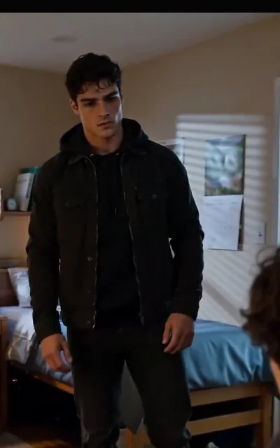 The dorm-room confrontation that opens the series — Kael in all black in the bedroom, a sliver of Liam’s stunned silhouette at the frame’s edge, staged exactly as shot; also the source of Kael’s avatar (ep1)