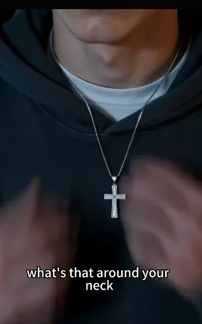 The question that turns the episode — "what's that around your neck" — the silver cross at the center of the estrangement, asked in close frame (ep3, subtitles as aired)