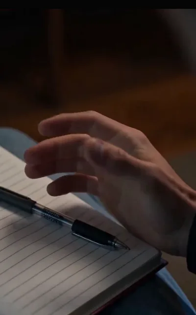 Liam writing in a notebook — the literature student’s craft carrying the quieter beat of the episode (ep4)
