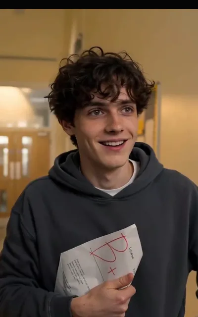 Liam beaming over an A-plus paper — the free block’s warmest beat and the source of his avatar (ep5)