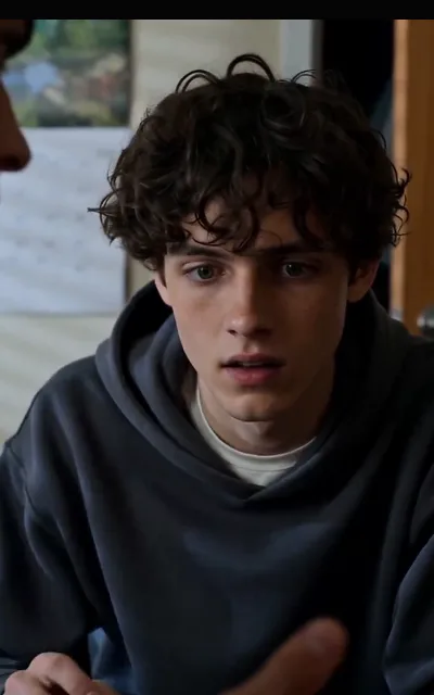 Liam mid-reaction in conversation — the free block’s closing stretch of revelations on his face (ep7)