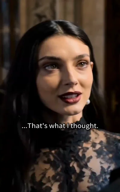 Episode 2 frame: close-up of Bella's face as she smirks — '...That's what I thought.' — defiance beneath the veil