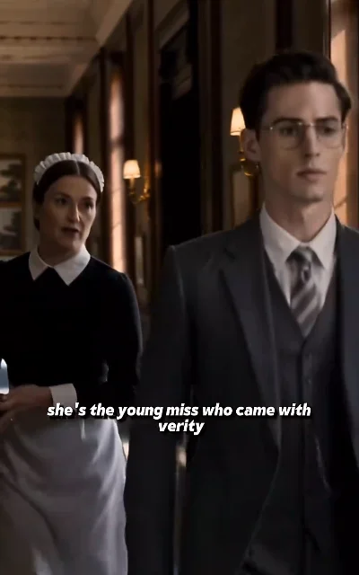 Episode 7 frame: servant dialogue, 'she's the young miss who came with verity' — subtitles as aired, name anchor