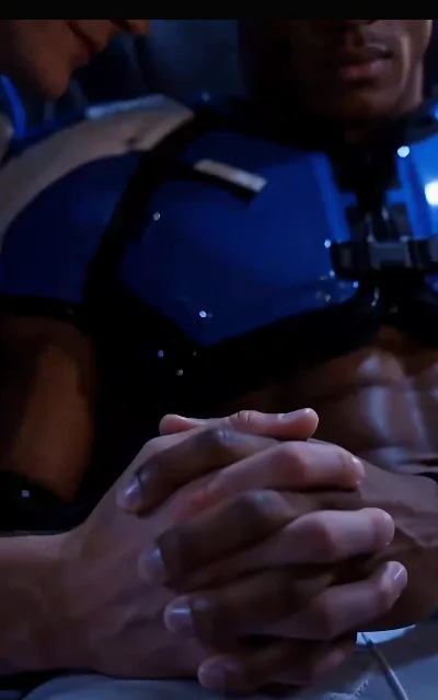 Two hands clasped fingers-interlocked in the blue-lit cabin — one fair, one deep, the hold saying what the uniforms keep quiet (ep4)