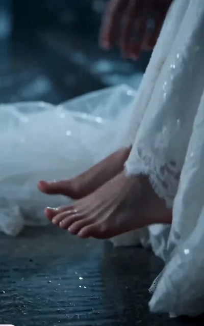 Episode 1 frame: wet bridal shoes on stone steps, emotional empty shot — the abandonment aftermath detail