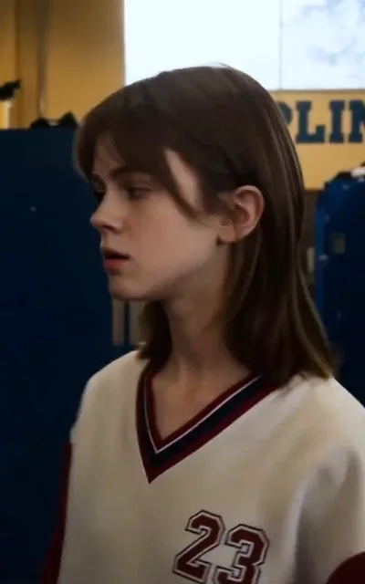 Zoe adrift in her number 23 jersey, staring at something only she can see — the reborn girl counting her debts