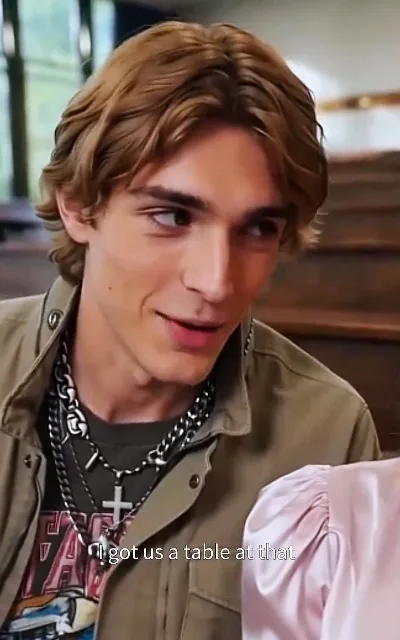 'I got us a table at that…' — the mistress locks in the reservation, staking her claim on Julian
