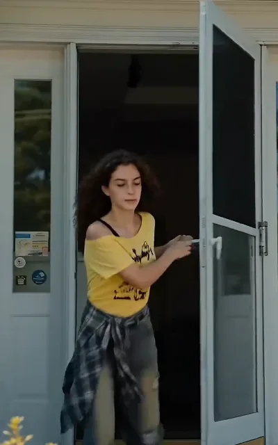 Heading out the door with a bag over the shoulder — the first-day-at-a-new-school energy