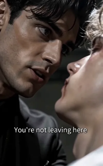 "You're not leaving here." — Dante in a black shirt, soaked hair pressed close to a fair-haired man with a bloodied lip: the first standoff after the cover is blown (ep1, subtitles as aired; threat frame as aired, no graphic detail)