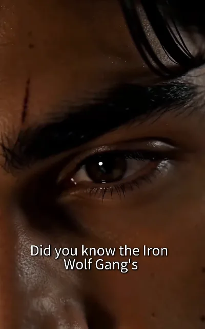 "Did you know the Iron Wolf Gang's" — a tear-slide close-up on Evan's eye, the sentence breaking off exactly where the subtitle aired it: the gang's name anchored in-frame, truncated as aired and not completed on this page (ep3, subtitles as aired; truncated as aired — no completion supplied)