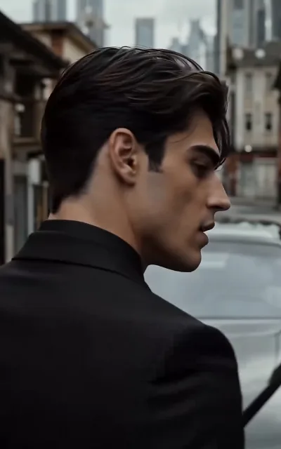 Evan in profile against the city skyline — the undercover's loneliest framing, one face for two lives (ep5)