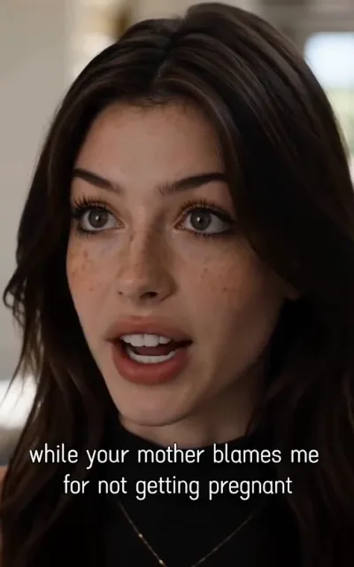 The grievance — a soft-lit close-up of a freckled woman with dark chestnut waves in a black turtleneck and layered gold necklaces, eyes lifted mid-plea, the captioned line while your mother blames me for not getting pregnant beneath (ep4; atmosphere beat — the marriage-strain backstory, station as-aired line, not a quote-card selection, not amplified)