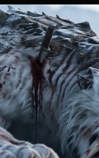 The close-quarters hunt — a blade driven into the white pelt of the beast, snow and iron and survival (ep4; combat frame as aired, not amplified)
